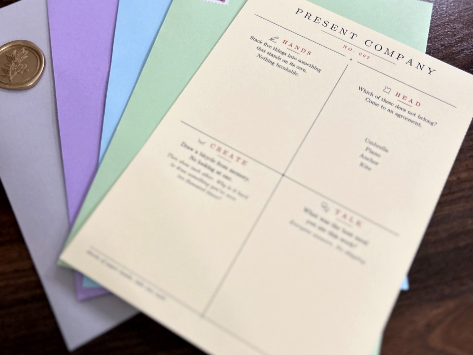 Several coloured envelopes fanned out behind a Together Club card.